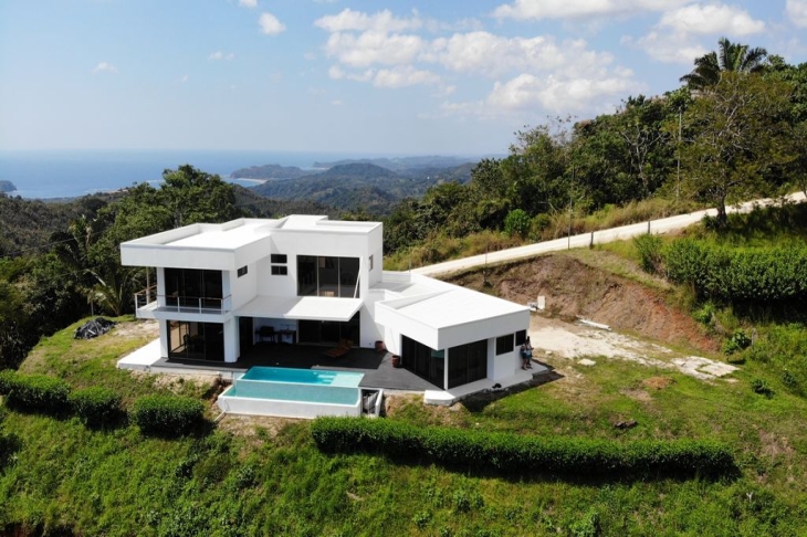 drone view with ocean at the back Casa Ying Yang high-end home for sale samara costa rica