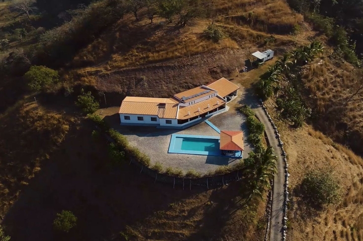drone view of main house with pool of Finca Las Nubes home and land for sale samara guanacaste costa rica