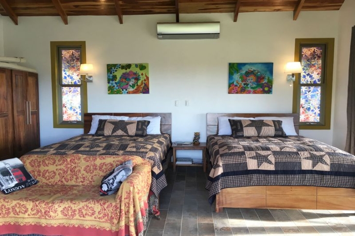 double beds in bedroom of Moutain Lodge vista Mar hotel for sale samara costa rica