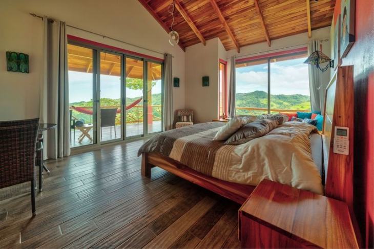 bedroom with mountain views at Moutain Lodge vista Mar hotel for sale samara costa rica