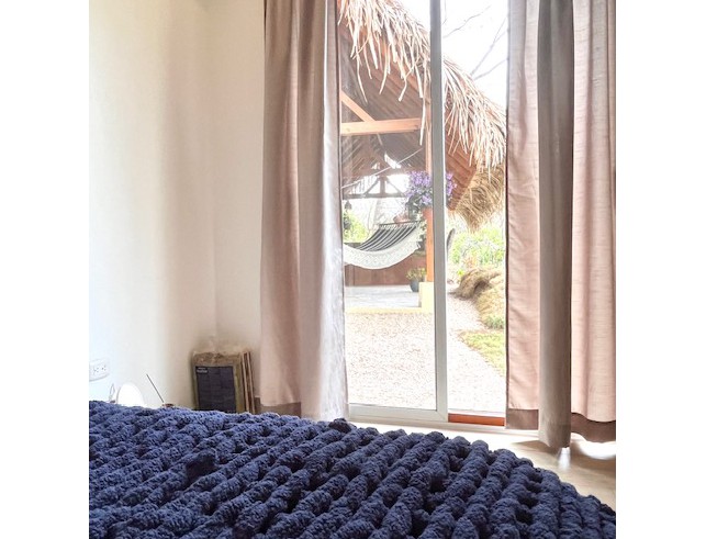 glass door of bedroom in Casa Dragonfly home for sale samara costa rica