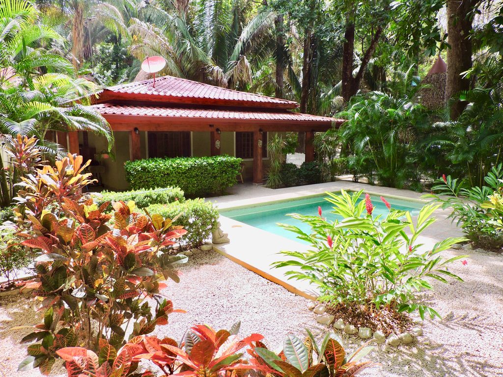 Tropical garden at Casa Colibri, home for sale at Samara Beach, Guanacaste, Costa Rica