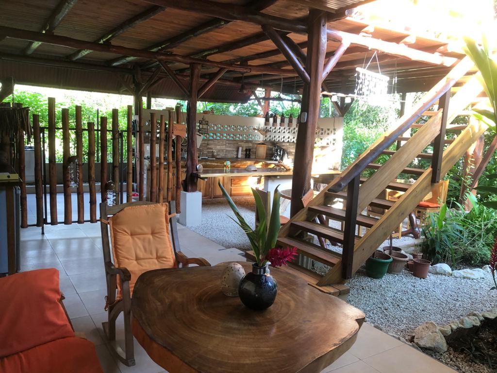 Wooden staircase of Relax Lodge hotel and rental income property, for sale atSamara Beach, Guanacaste, Costa Rica