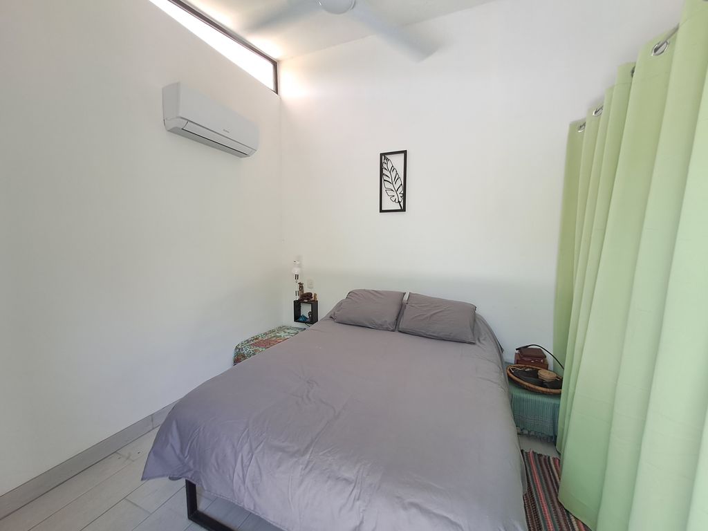 Single bed bedroom of Casa Jungla Tranquila, home for sale at Samara Beach, Guanacaste, Costa Rica