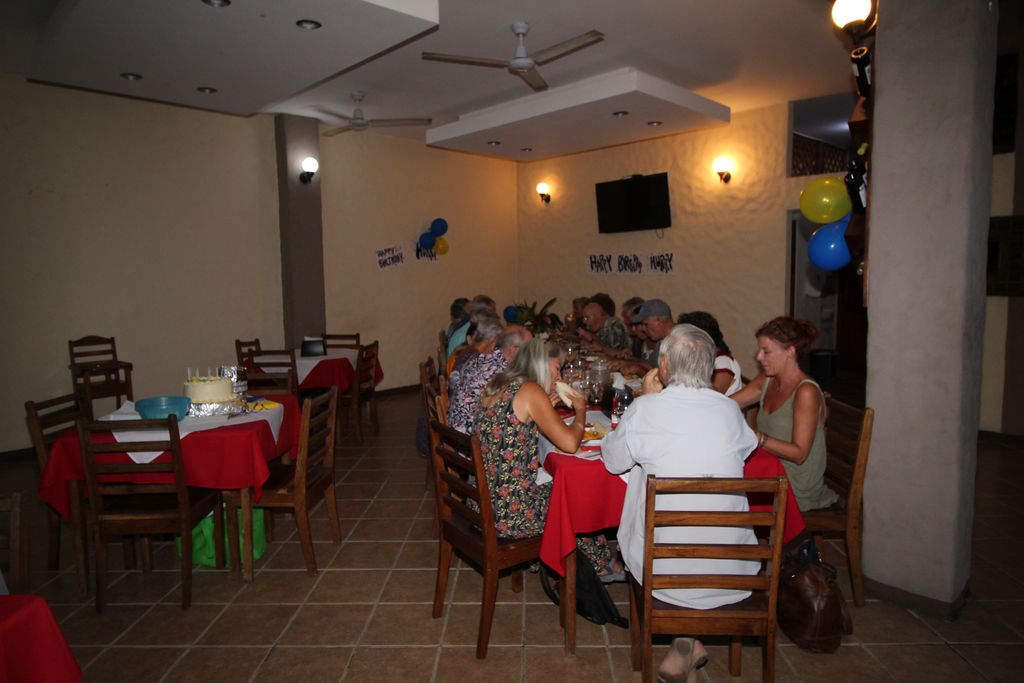 Large table with guest at night of Casa Emerald, Restaurant and Cabinas for sale at Samara Beach, Guanacaste, Costa rica