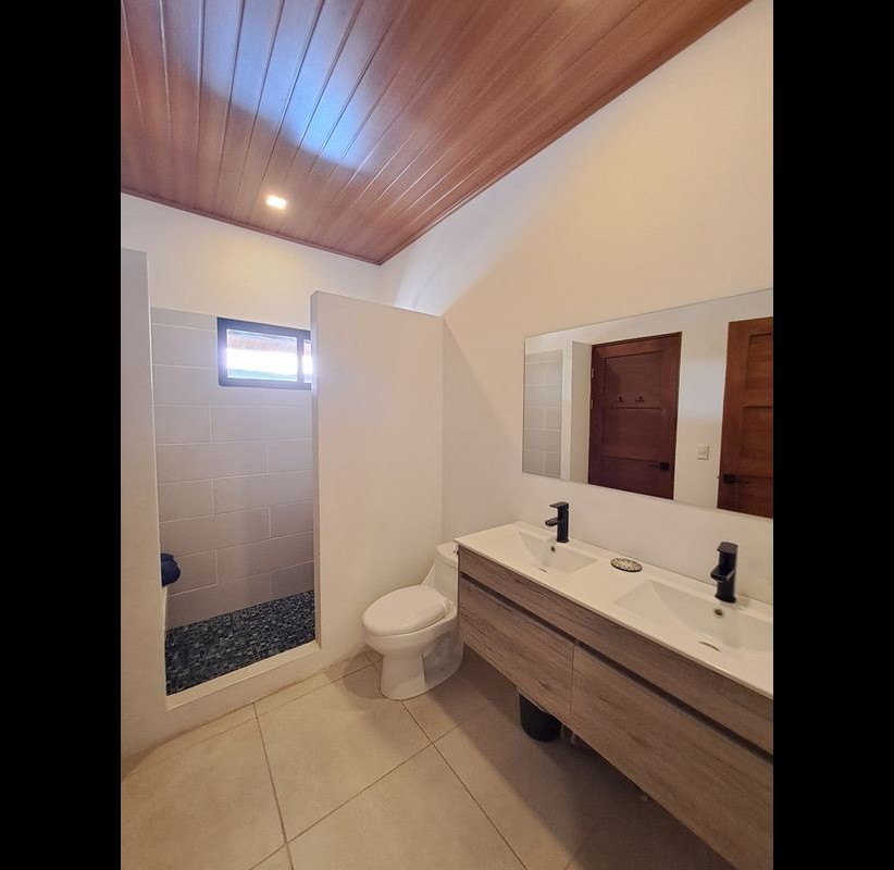 bathroom with two sinks at Casa Nueva house for sale Samara Guanacaste Costa rica
