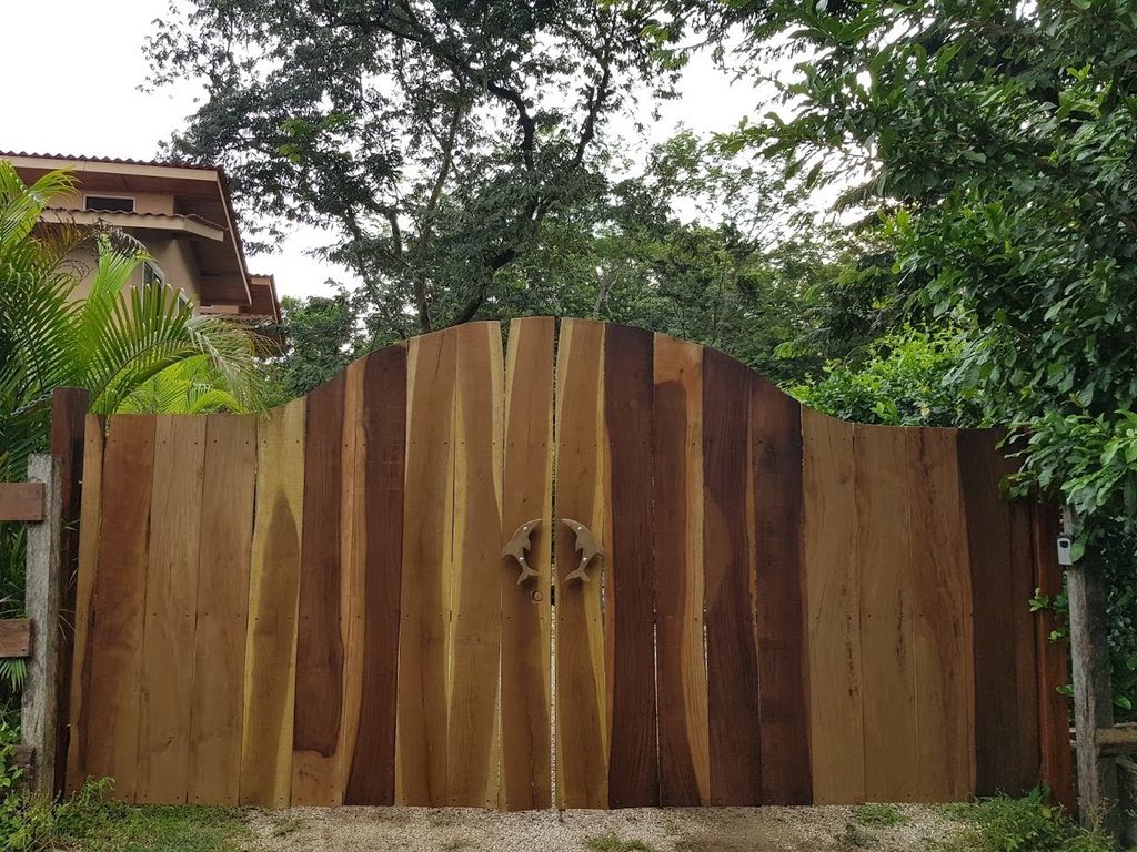 Main wooden gate at Casa La Isla, rental income property for sale at Samara Beach, Costa Rica