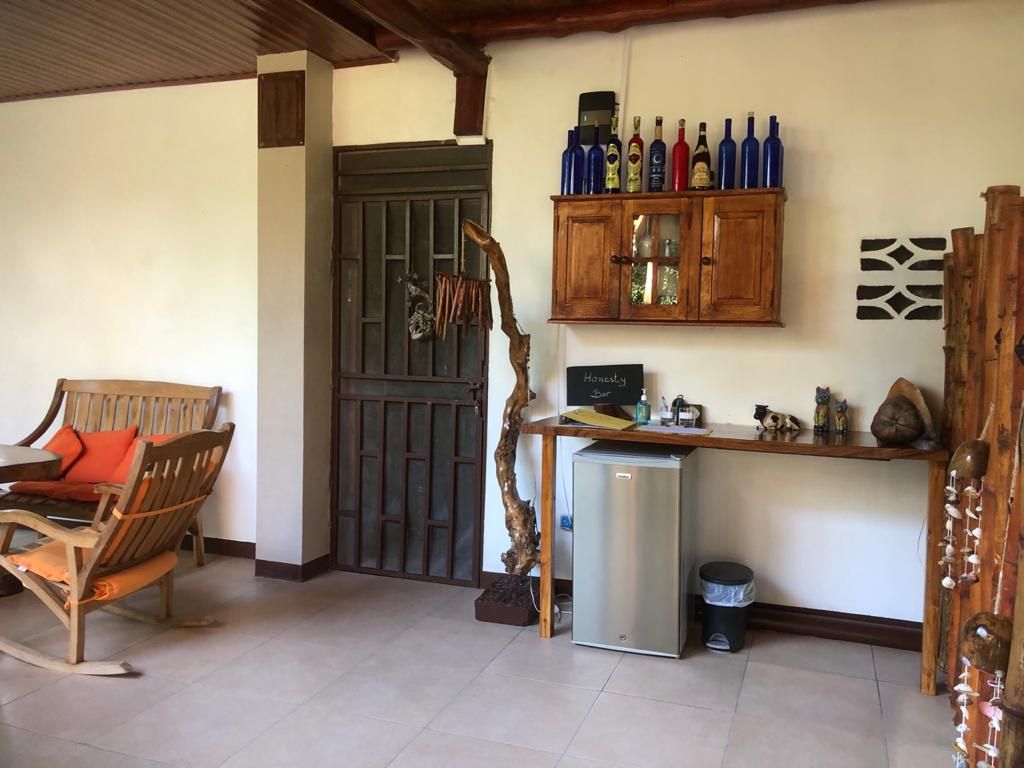 Outdoor terrace on first floor with refri for guest at Relax Lodge hotel and rental income property, for sale atSamara Beach, Guanacaste, Costa Rica