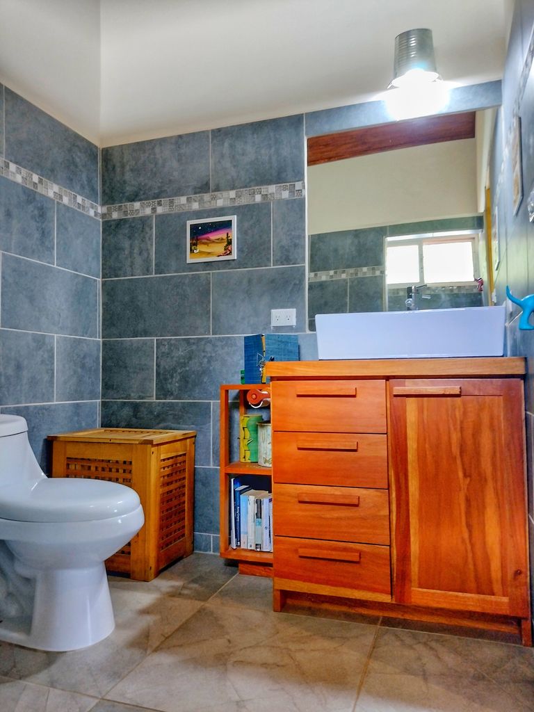 wooden furniture and sink in Casa ceiba hotel and rental income property for sale at Samara Beach Guanacaste Costa Rica