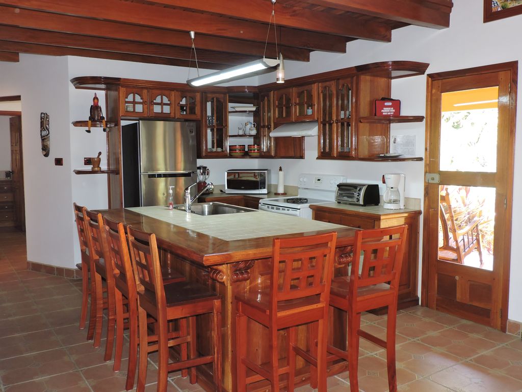 kitchen island with stools in Casa Mariposa, home for sale at Samara Beach, Guanacaste, Costa Rica