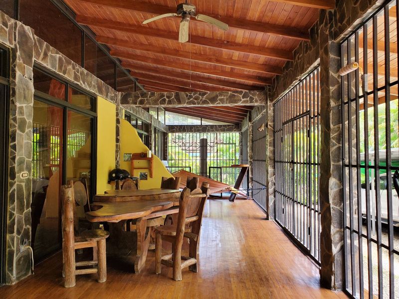Wooden chairs and table on terrace of Casa Sol, house for sale at Samara, Guanacaste, Costa Rica