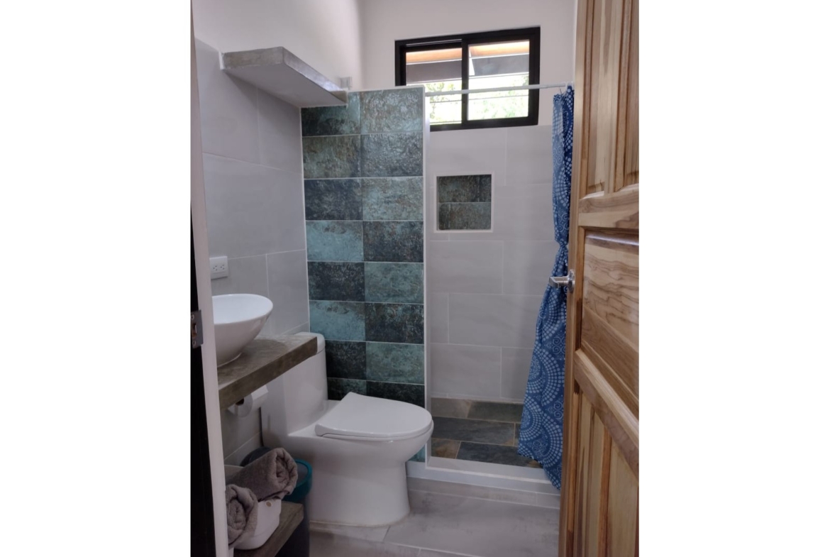lovely modern bathroom of Casa espinoza home for sale samara costa rica