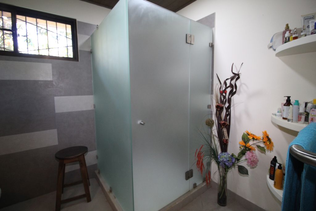 bathroom with shower of Casa Nela, hotel and rental income property for sale at Samara Beach, Guanacaste, Costa Rica