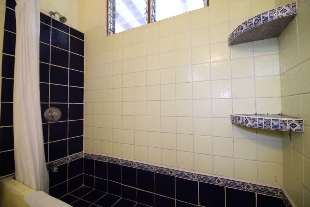 Bathroom with blue tiles of Samara Central Hotel, business for sale at Samara Beach, Guanacaste, Costa Rica