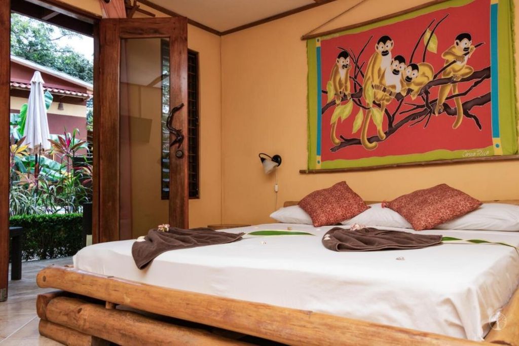 Great wooden bed at Hotel Las Palmas, business for sale at Samara Beach, Costa Rica