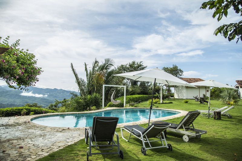 Green grass aroung pool at the Peaceful Retreat Hotel for sale at Carillo Beach Costa Rica