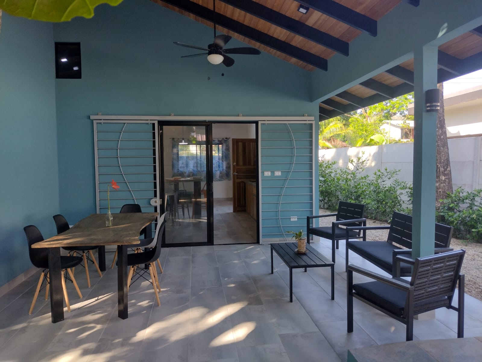 covered terrace with lounge area at Casa espinoza home for sale samara costa rica