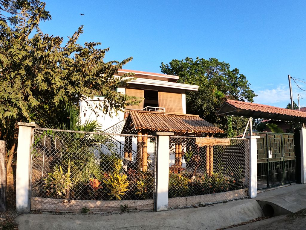 Secure gate of Casa Nela, hotel and rental income property for sale at Samara Beach, Guanacaste, Costa Rica