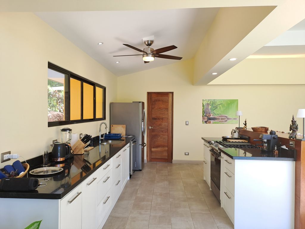 side view of kitchen in Casa Ananda home for sale Carillo Beach samara costa rica