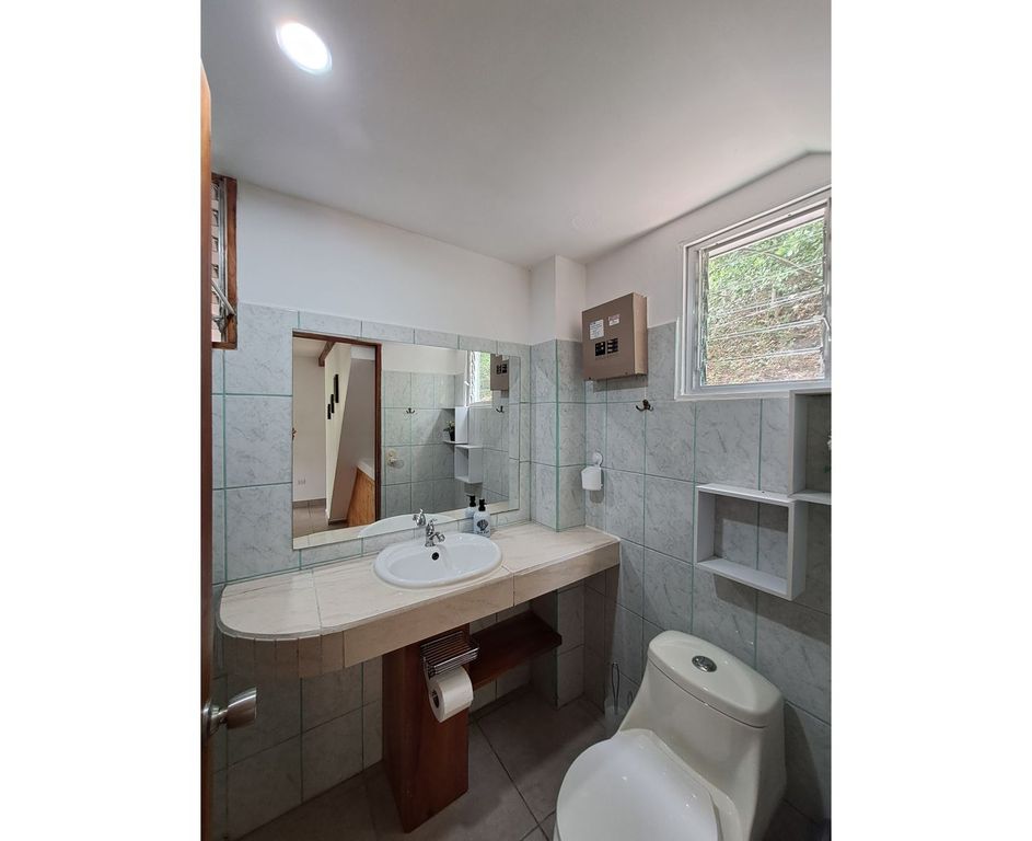 Bathroom view with sink and toilet of Casa Granada, home for sale at Samara Beach, Guanacaste, Costa Rica
