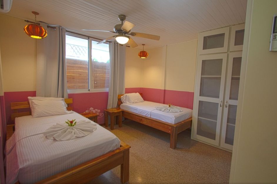 Pink double bedroom at Hotel Pacifico, business for sale at Samara Beach, Guanacaste, Costa Rica