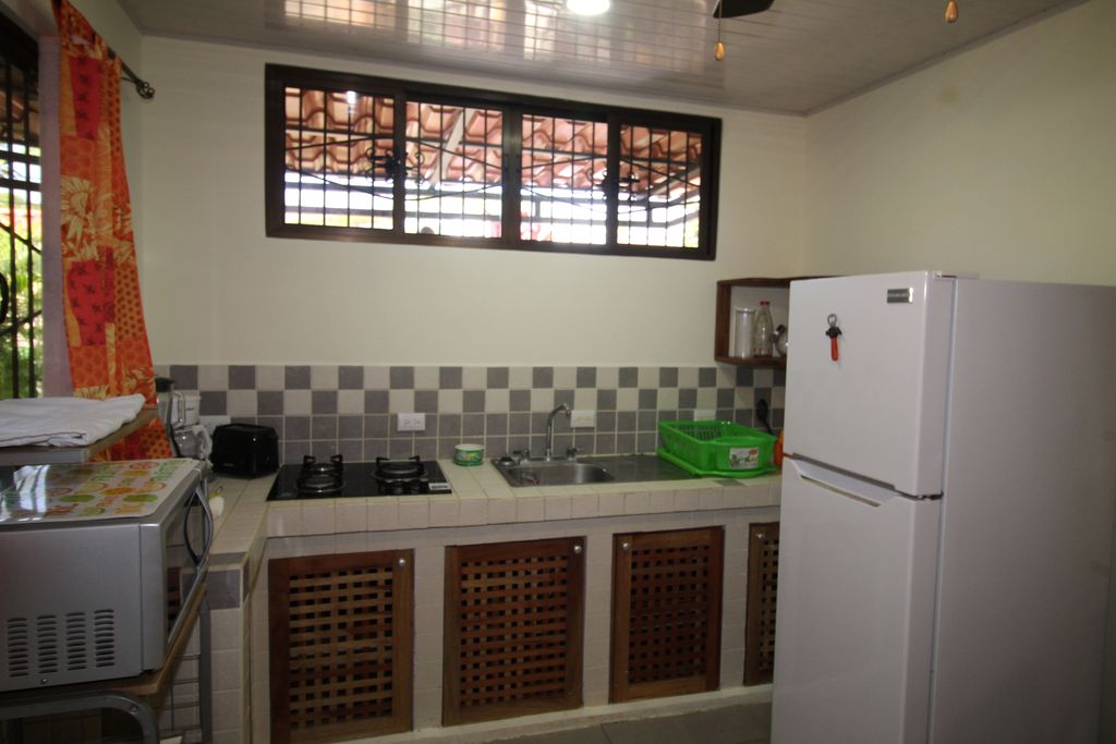 equipped kitchen of Casa Nela, hotel and rental income property for sale at Samara Beach, Guanacaste, Costa Rica
