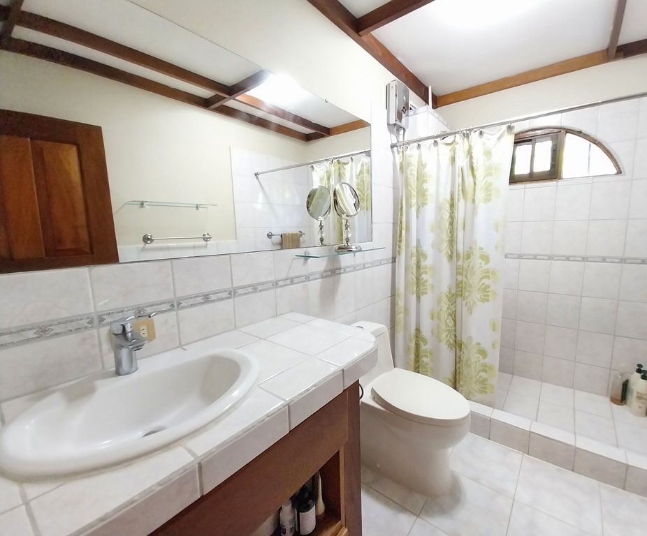 Other white bathroom with custon made ceiling of Casa Bella Montaña, home for sale at Samara Beach, Guanacaste, Costa Rica