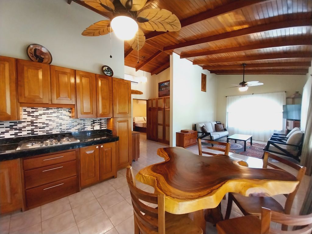 charming wooden table with chairs in kitchen of Casa Bella Montaña home for sale Samara Beach Guanacaste Costa Rica