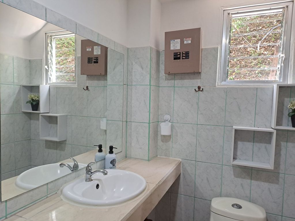 Bathroom with one sink of Casa Granada, home for sale at Samara Beach, Guanacaste, Costa Rica