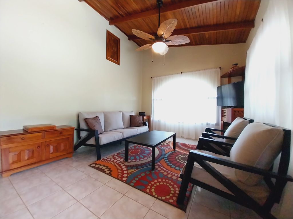 confortable lounge area with TV in Casa Bella Montaña home for sale Samara Beach Guanacaste Costa Rica