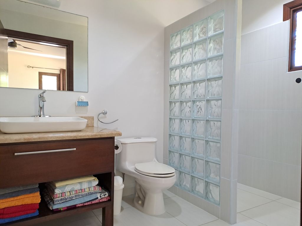 Toilet and shower of Casa Tucancillo, home for sale at Samara Beach, Guanacaste, Costa Rica