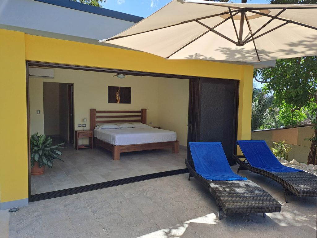 long chairs on terrace of master bedroom at Casa Ananda home for sale Carillo Beach samara costa rica