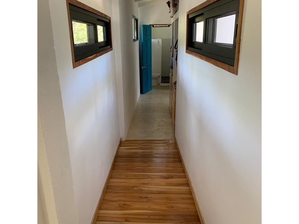 Corridor from main house to apartment of Casa Baoba, house for sale at Samara Beac,h Guanacaste, Costa Rica