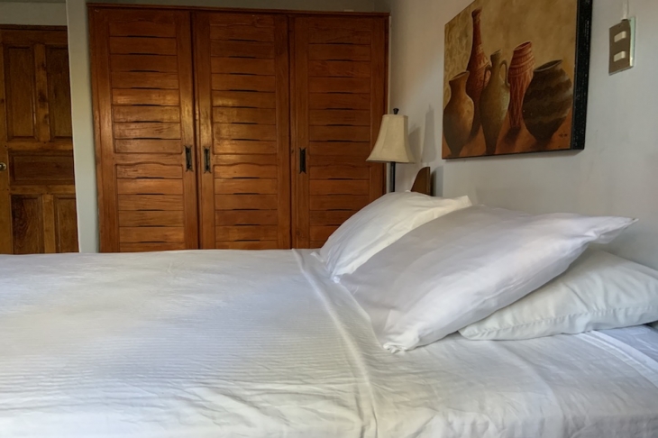 white sheets on bed at Villa Amanecer, house for sale at Carrillo Beach, Guanacaste, Costa Rica