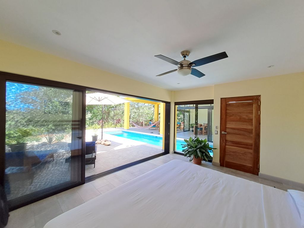pool view from master bedroom of Casa Ananda home for sale Carillo Beach samara costa rica