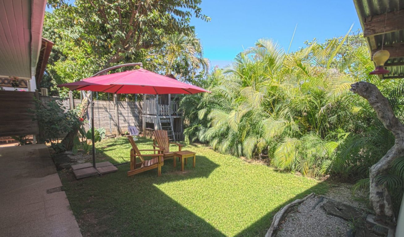 Backyard with armchairs at Hotel Pacifico, business for sale at Samara Beach, Guanacaste, Costa Rica