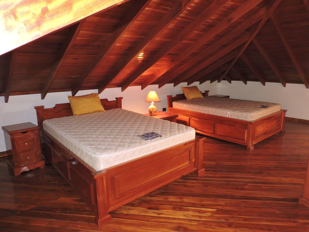 double beds in the mezzanine of Casa Mariposa, home for sale at Samara Beach, Guanacaste, Costa Rica