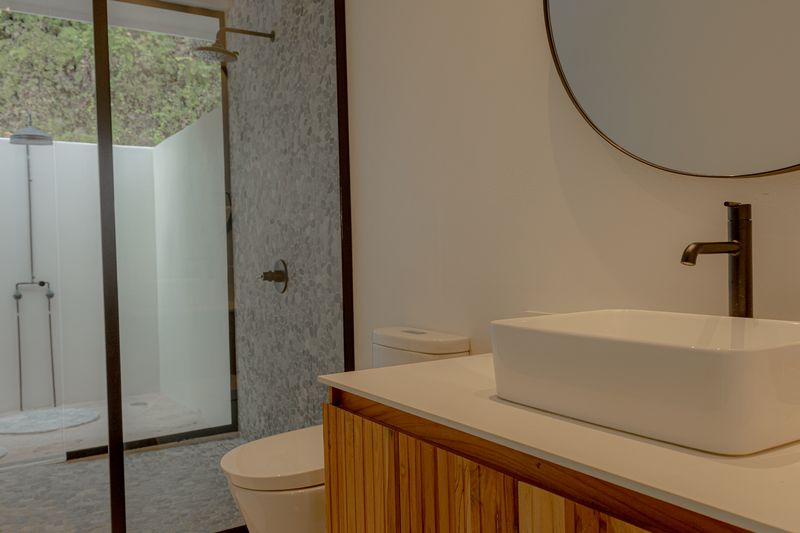 Bathroom and his outdoor shower of Casamigos, luxury home for sale Punta Islita Samara Costa Rica