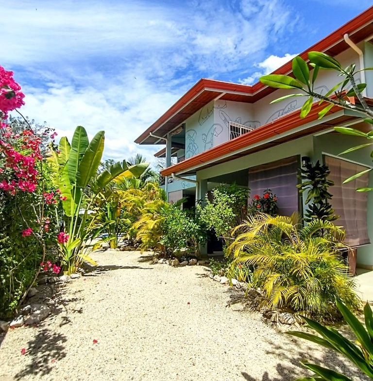 main entrance and garden at Casa ceiba hotel and rental income property for sale at Samara Beach Guanacaste Costa Rica