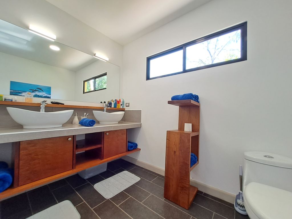 modern furniture with double white sinks in Casa Ananda home for sale Carillo Beach samara costa rica
