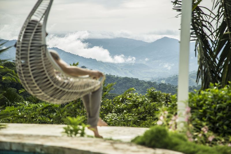 Relaxing on a chair hammok at the Peaceful Retreat Hotel for sale at Carillo Beach Costa Rica
