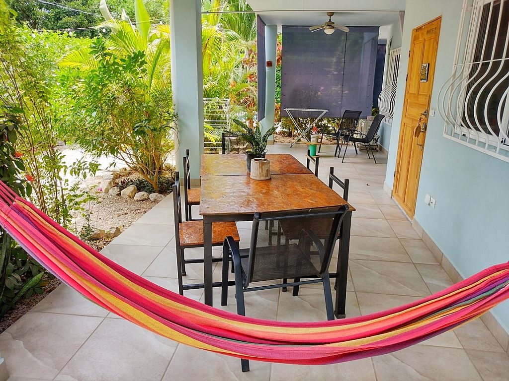 lovely hammock and dining area at Casa ceiba hotel and rental income property for sale at Samara Beach Guanacaste Costa Rica