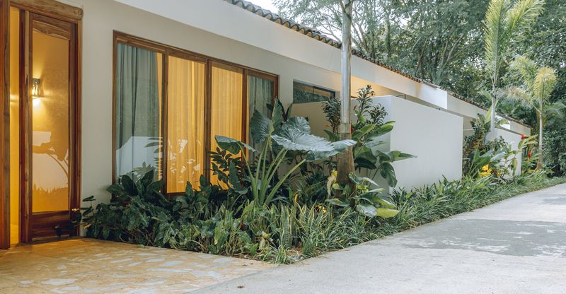 Tropical entrance jardin of Casamigos, luxury home for sale Punta Islita Samara Costa Rica