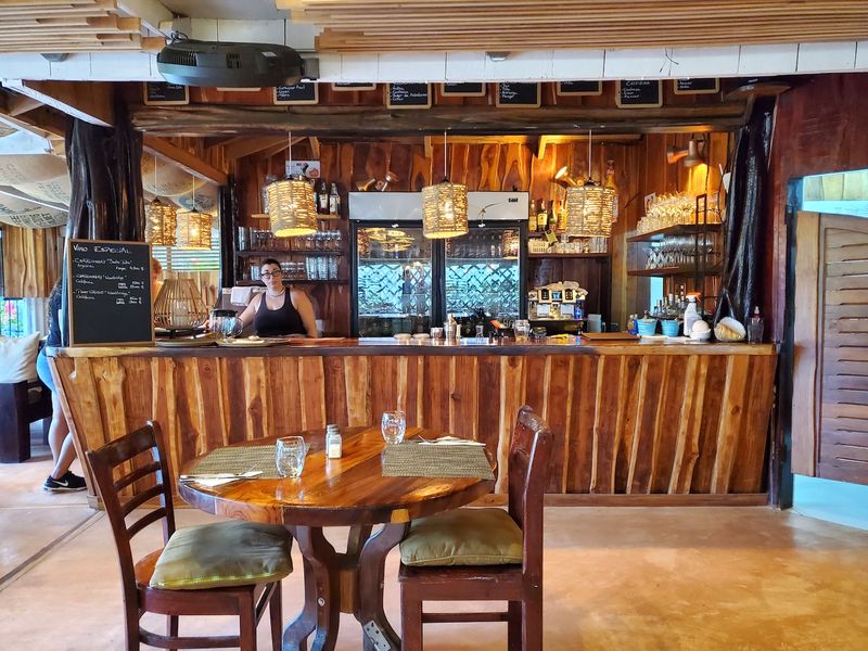 Rustic wooden bar of Restaurant Gourmet Sol y Vino for sale at Samara, Costa Rica