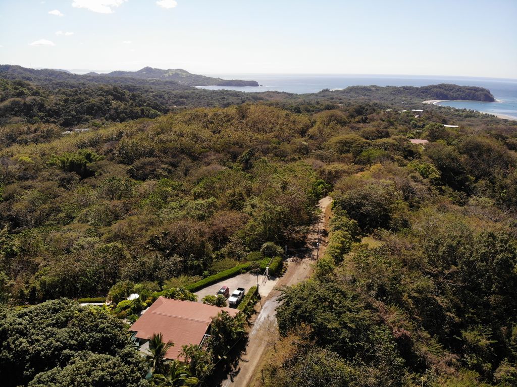 Drone view with ocean from Casa Bella Montaña, home for sale at Samara Beach, Guanacaste, Costa Rica