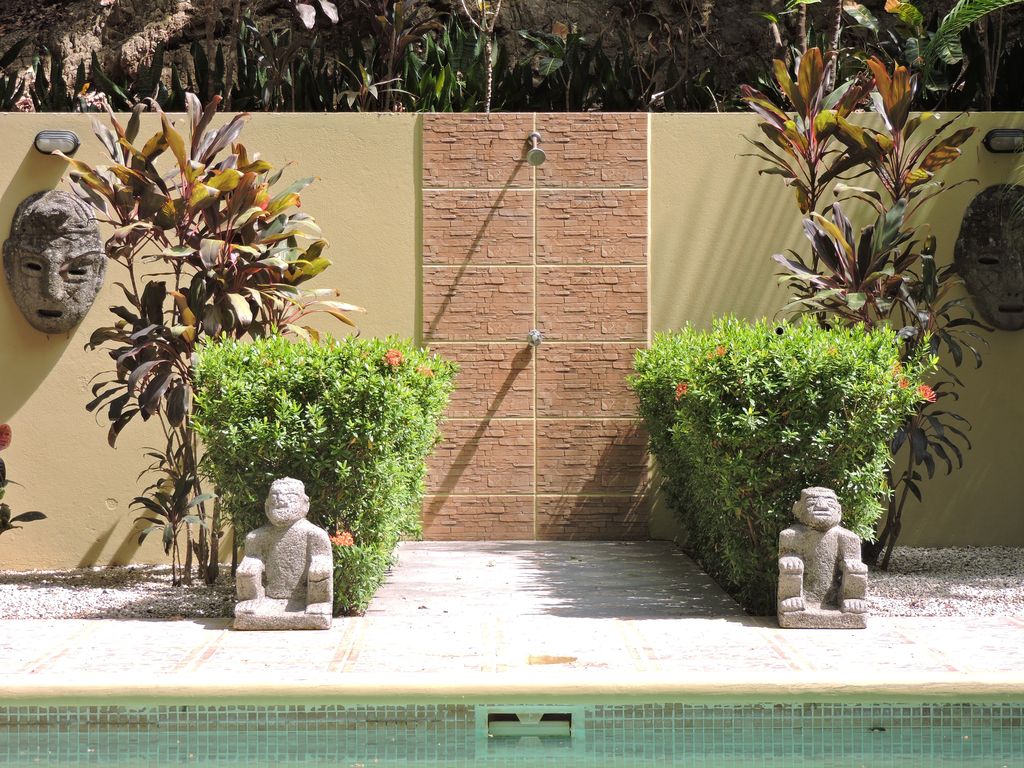Outdoor stone shower at Casa Colibri, home for sale at Samara Beach, Guanacaste, Costa Rica
