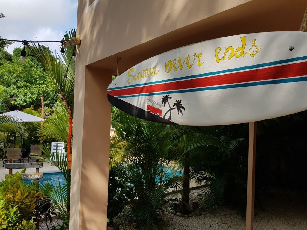 Surf board sign at Casa La Isla, rental income property for sale at Samara Beach, Costa Rica