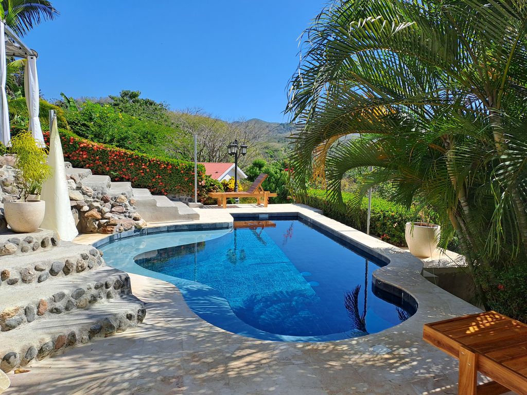 Pool and mountains view from Casa Bella Montaña, home for sale at Samara Beach, Guanacaste, Costa Rica