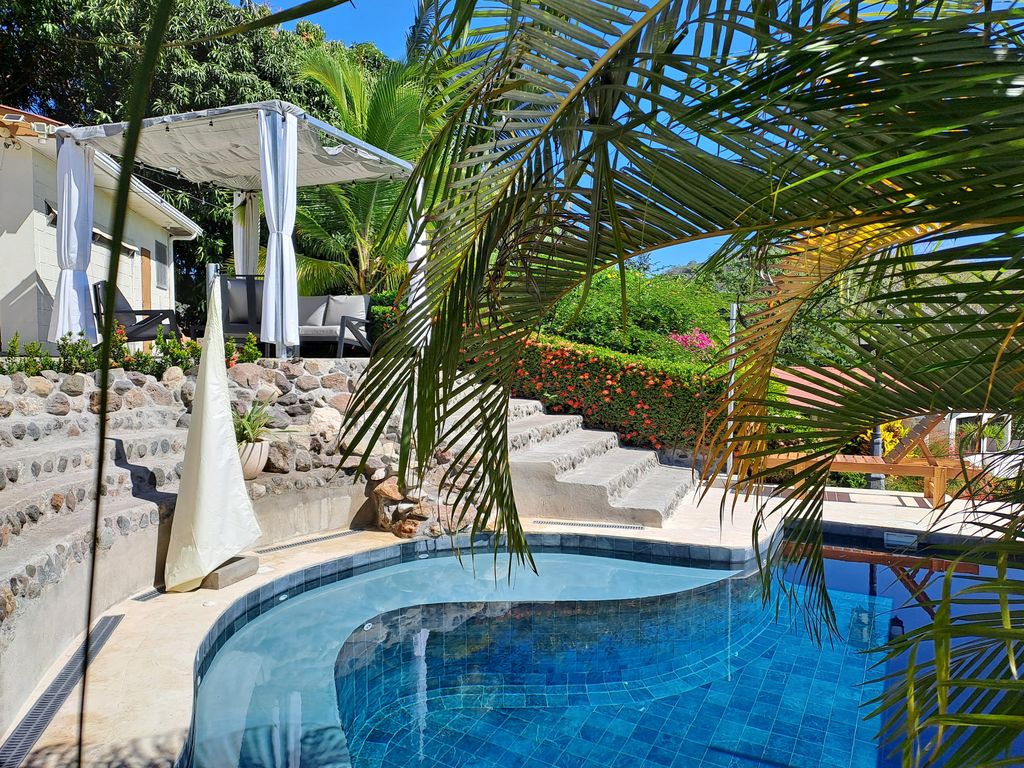 Steps to acesss to pool of Casa Bella Montaña, home for sale at Samara Beach, Guanacaste, Costa Rica
