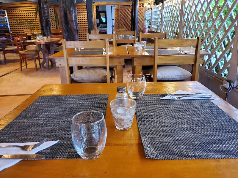 a table set and ready for service at Restaurant Gourmet Sol y Vino for sale at Samara, Costa Rica